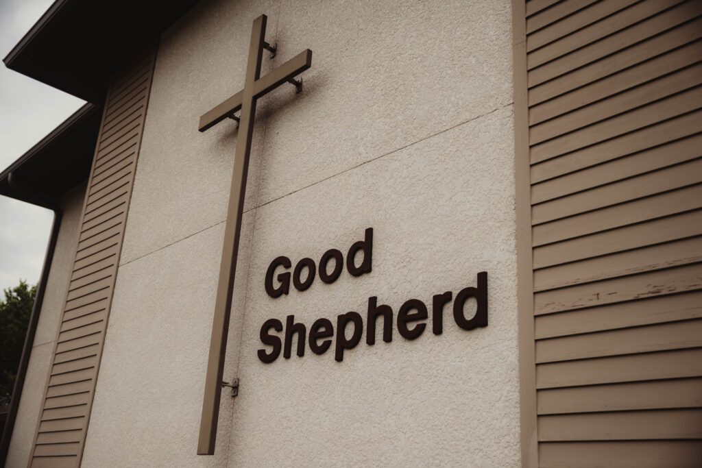 Close up picture of the cross on the outside of the church building